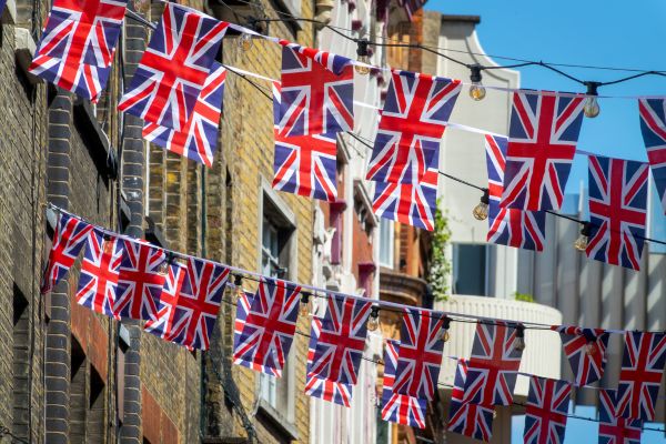 street party in the UK with Union Jack flags strung between houses